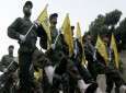 File photo shows Hezbollah combatants march in a rally.
