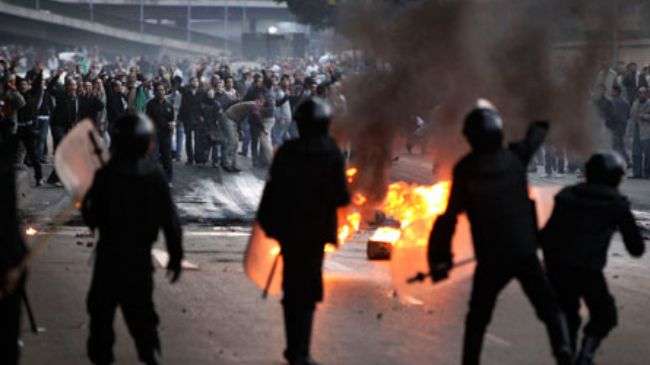 Egypt police clash with protesters in Cairo, Suez