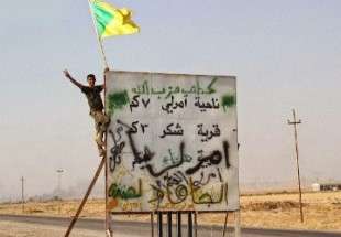 رفع راية حزب الله مكان علم "داعش" في أمرلي – العراق