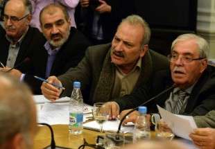 Negotiators attend a talks between representatives of the Syrian government and the Syrian opposition in Moscow on January 28, 2015.