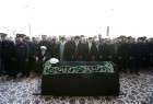 Leader performs prayers as funeral held for late cleric