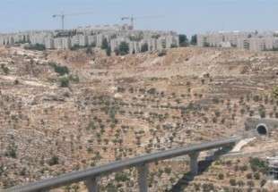 An ‘Israeli only’ by-pass road that links settlements in the occupied West Bank is shown sitting below an Israeli settlement outside al-Quds (Jerusalem).
