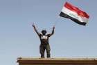 القوات الأمنية تحرر معمل اسمنت بادوش وترفع العلم العراقي فوقه