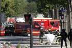 Car rams police van in Paris, armed suspect dies
