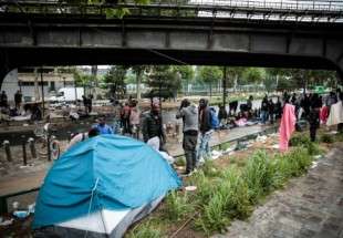 Migrants de France sans abri camperaient dans les rues