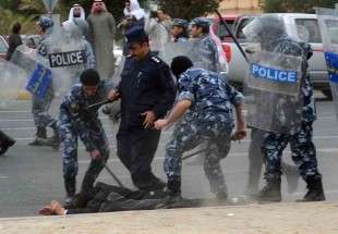 Kuwaiti riot police arrest a stateless Arab man during a demonstration to demand citizenship (AFP)
