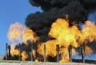 Excess flammable gasses burning from flares at Havana oil field, west of Iraqi city of Kirkuk