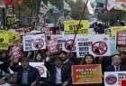 برپایی تظاهرات ضد جنگ همزمان با ورود ترامپ به کره جنوبی