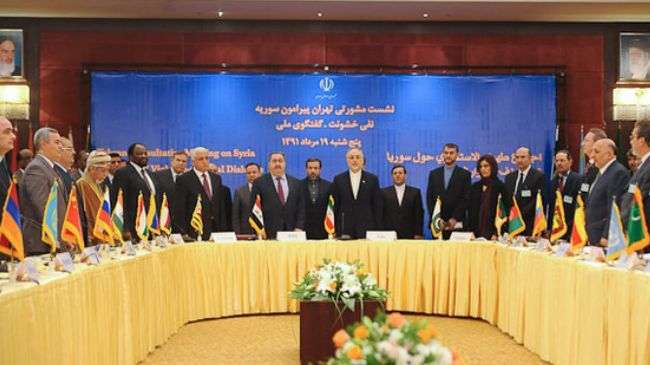 Officials and representatives from over 30 countries pose for a photo during a day-long international consultative meeting on Syria, Tehran, August, 2012.