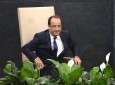 French President Francois Hollande stands up to address the 68th session of the United Nations General Assembly in New York on September 24, 2013.