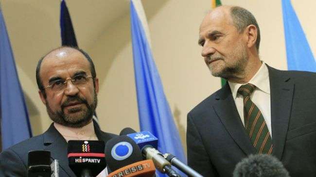 Iran’s Ambassador to the International Atomic Energy Agency (IAEA) Reza Najafi (L) and IAEA Deputy Director General and Head of the Department of Safeguards Herman Nackaerts, September 27, 2012