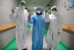 Iranian nurses showing victory sign after working long hours in a nation-wide campaign against coronavirus