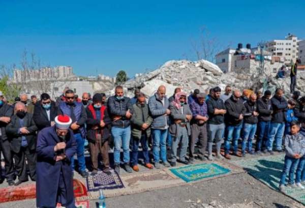 Palestinians hold Friday prayer in debris of home demolished by Israeli forces