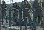 Israeli occupation forces looking at a Palestinian they have shot and killed in the West Bank.