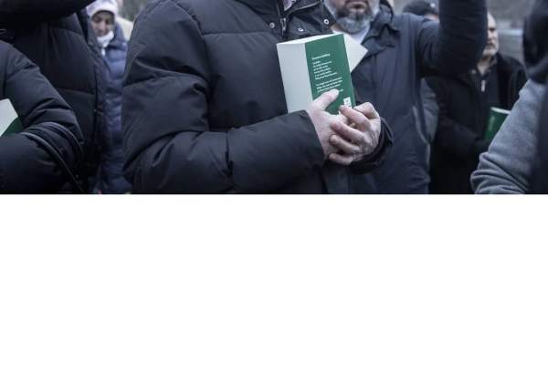 People stage a protest against the burning of the Quran in front of Swedish Embassy in Stockholm, Sweden on January 24, 2023 [Narciso Contreras/Anadolu Agency]