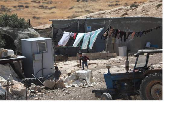 Members of Palestinian Masafer Yatta communities living in caves and makeshift buildings determined to remain in their land despite the Israeli court’s decision allowing the forced eviction, south of Hebron in West Bank on May 7, 2022. [Mamoun Wazwaz – Anadolu Agency]