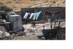 Members of Palestinian Masafer Yatta communities living in caves and makeshift buildings determined to remain in their land despite the Israeli court’s decision allowing the forced eviction, south of Hebron in West Bank on May 7, 2022. [Mamoun Wazwaz – Anadolu Agency]