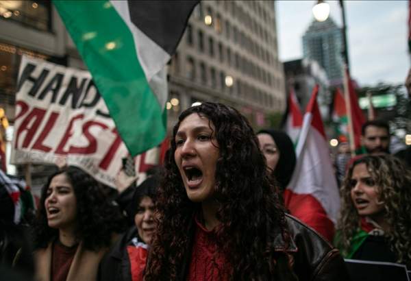 People gather to protest against Israeli airstrike on Al-Ahli Baptist Hospital in Gaza as Israeli attacks continue, in Montreal, Canada on October 17, 2023.