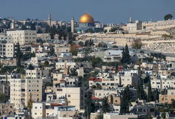 A picture taken from the West Bank town of Abu Dis, separated from Jerusalem by Israel’s controversial barrier, shows the Dome of the Rock (top) in Jerusalem’s al-Aqsa mosque compound and the Jewish cemetary of Mount of Olives (R), on 23 November 2020. [AHMAD GHARABLI/AFP via Getty Images]