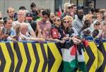 Protesters in Paris show solidarity with Palestine during Olympic cycling competition