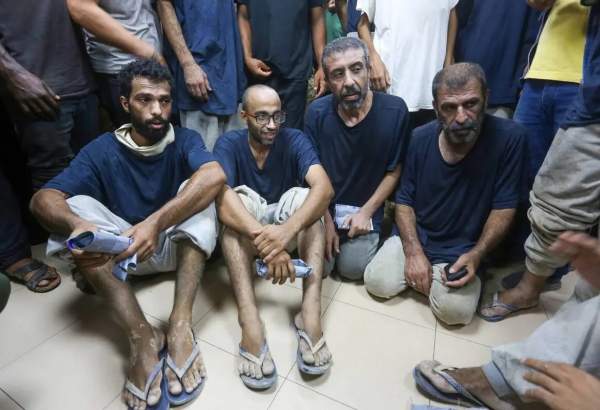 Palestinian prisoners, detained by the Israeli army, are taken to the al-Aqsa Martyrs Hospital for medical treatment, after being released by the Israeli forces in Deir al-Balah, Gaza on 1 August 2024 [Ashraf Amra/Anadolu Agency]