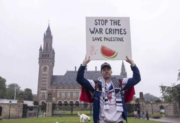 Pro-Palestinian protesters gather to show solidarity with Palestinians during a hearing near the International Court of Justice (ICJ) on May 24, 2024 in The Hague, Netherlands [Nikos Oikonomou – Anadolu Agency]